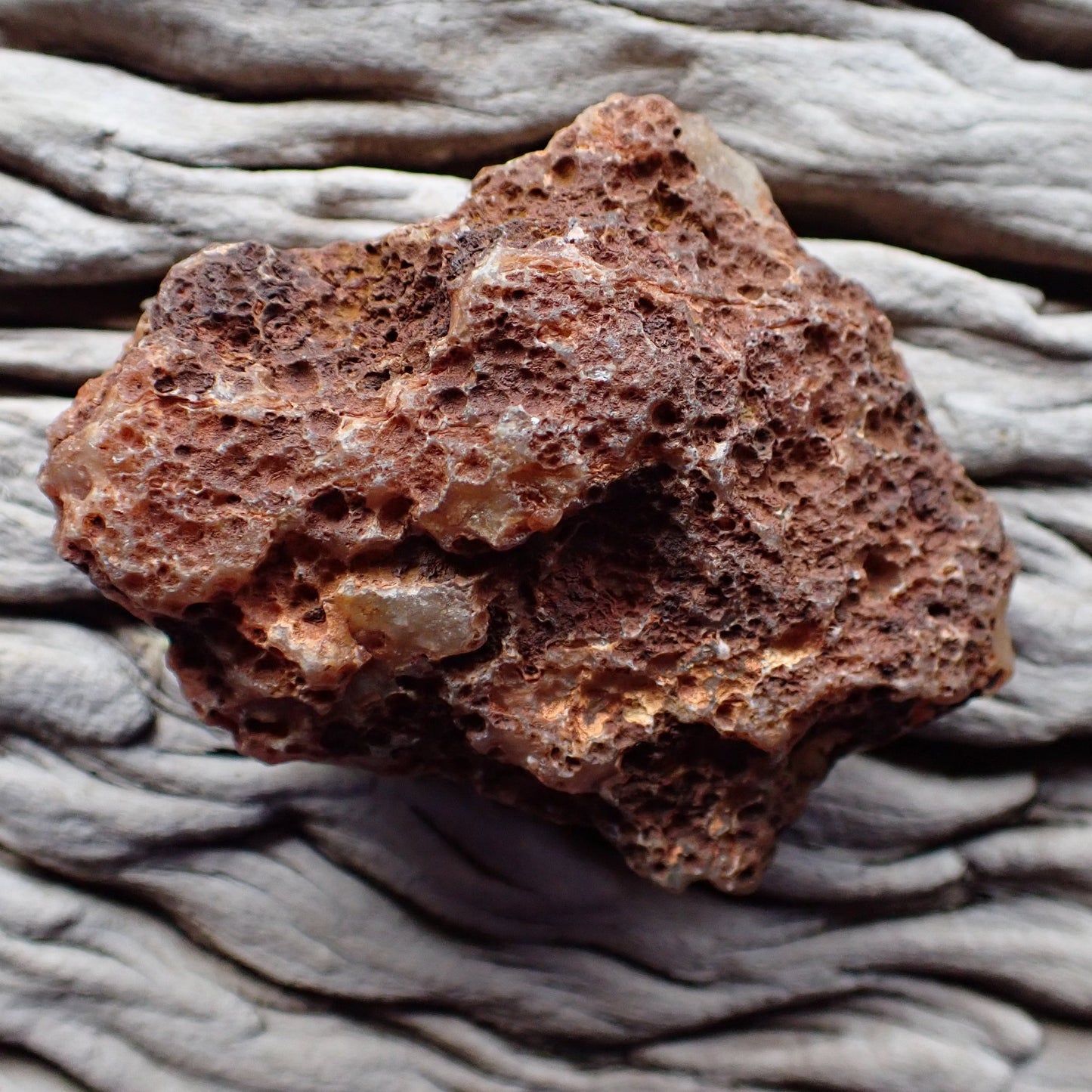 Unpolished rough side of a Malawi candy agate showing its natural texture