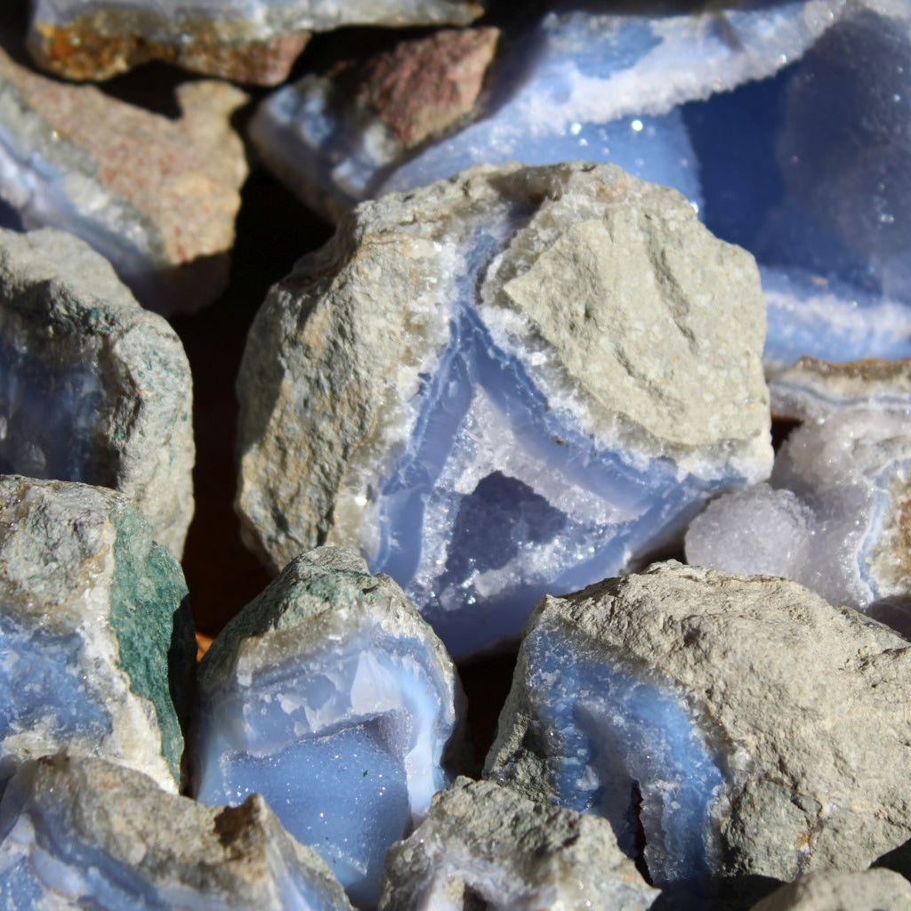 Wholesale Blue Lace Agate rough specimens, Nsanje Malawi – macro detail of rich blue chalcedony with visible banding layers and sparkling druzy surface | SKU BLAperkg
