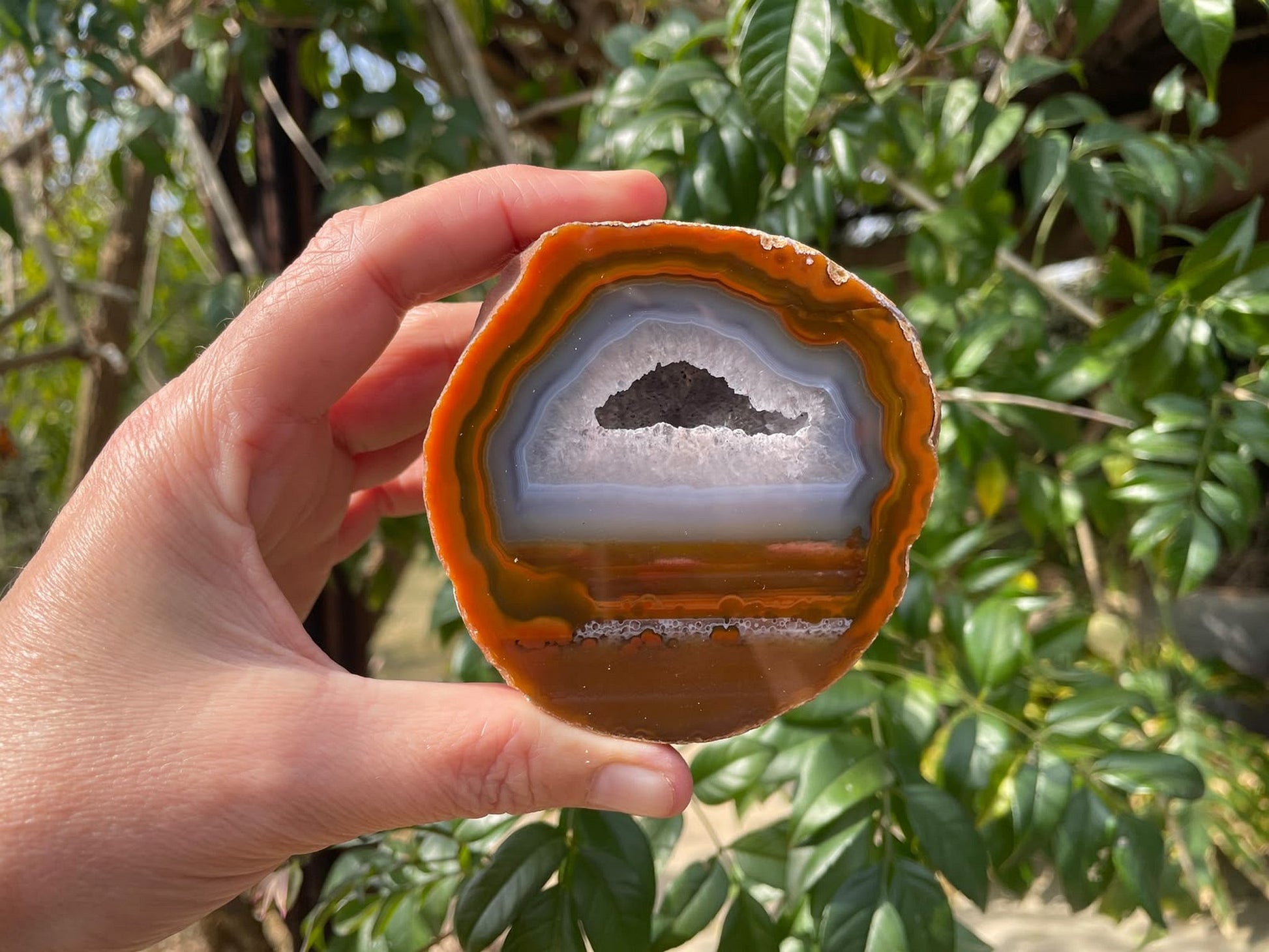 Lilangabi agate 84 mm – in-hand size reference, drusy vug, orange-amber banding, Eswatini collector specimen