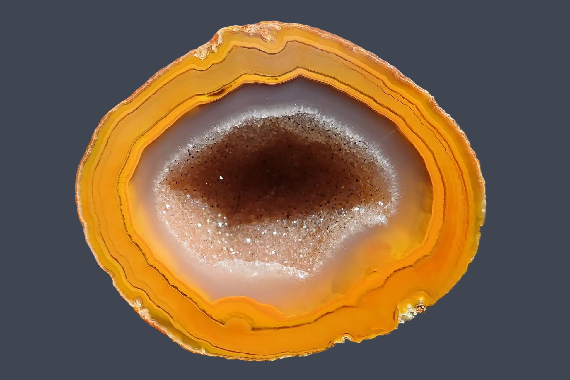 Lilangabi agate 59 mm – front face, large drusy vug with sparkling quartz crystals, vivid amber and deep orange banding