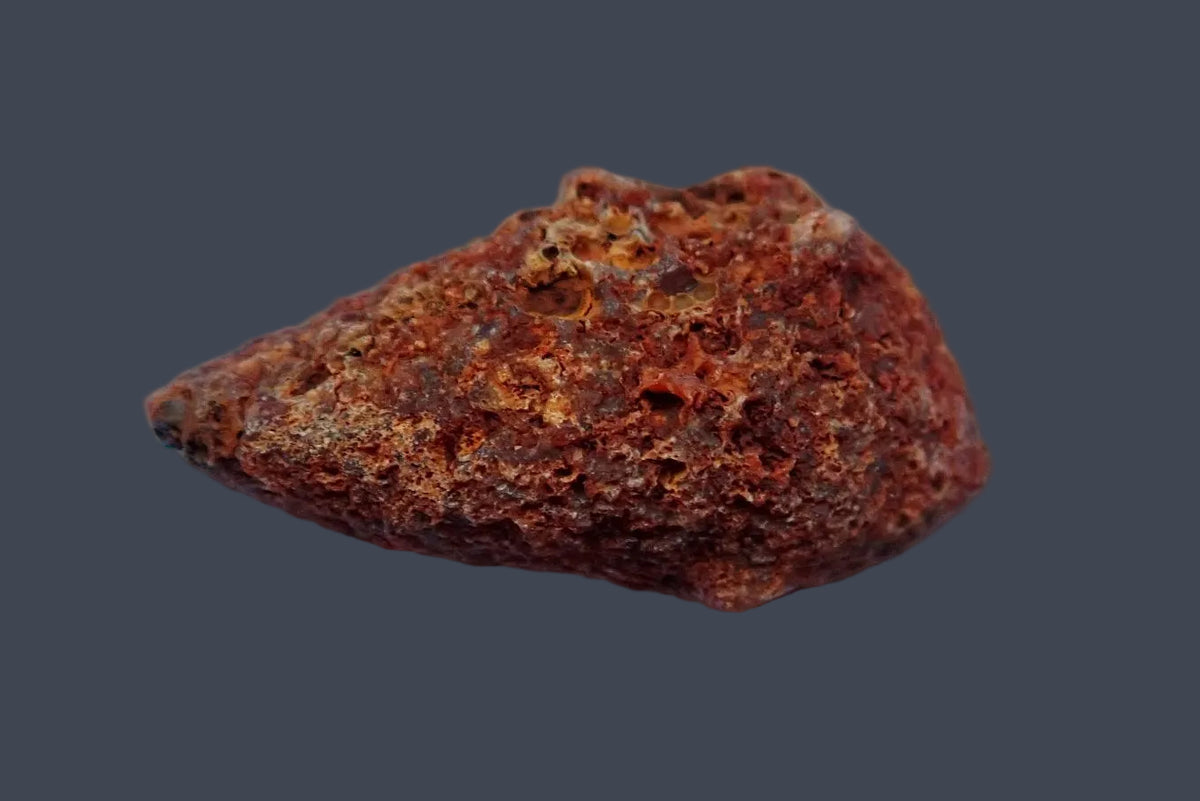 Malawi agate 57 mm, unpolished back showing a rough, reddish-brown natural exterior, Ngabu.