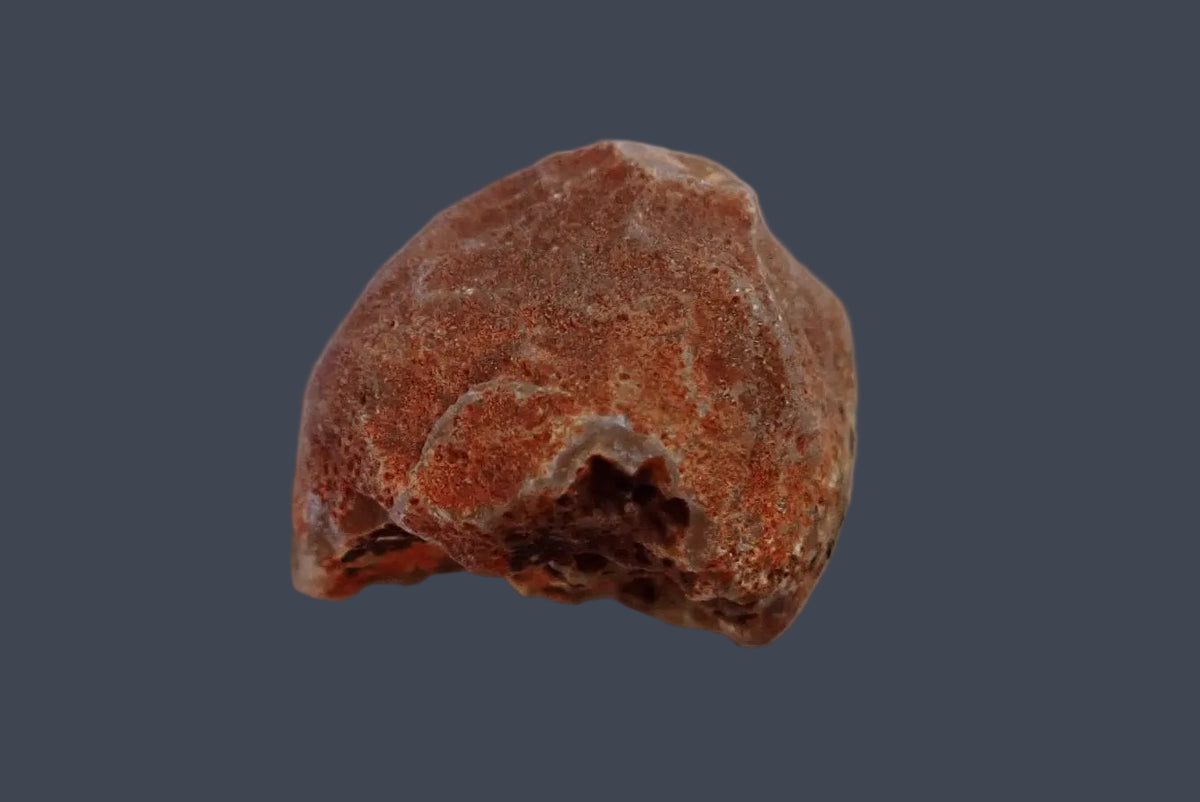 Malawi agate 38 mm – back view showing the rough reddish-brown natural rind and irregular lower opening, Ngabu, Malawi.