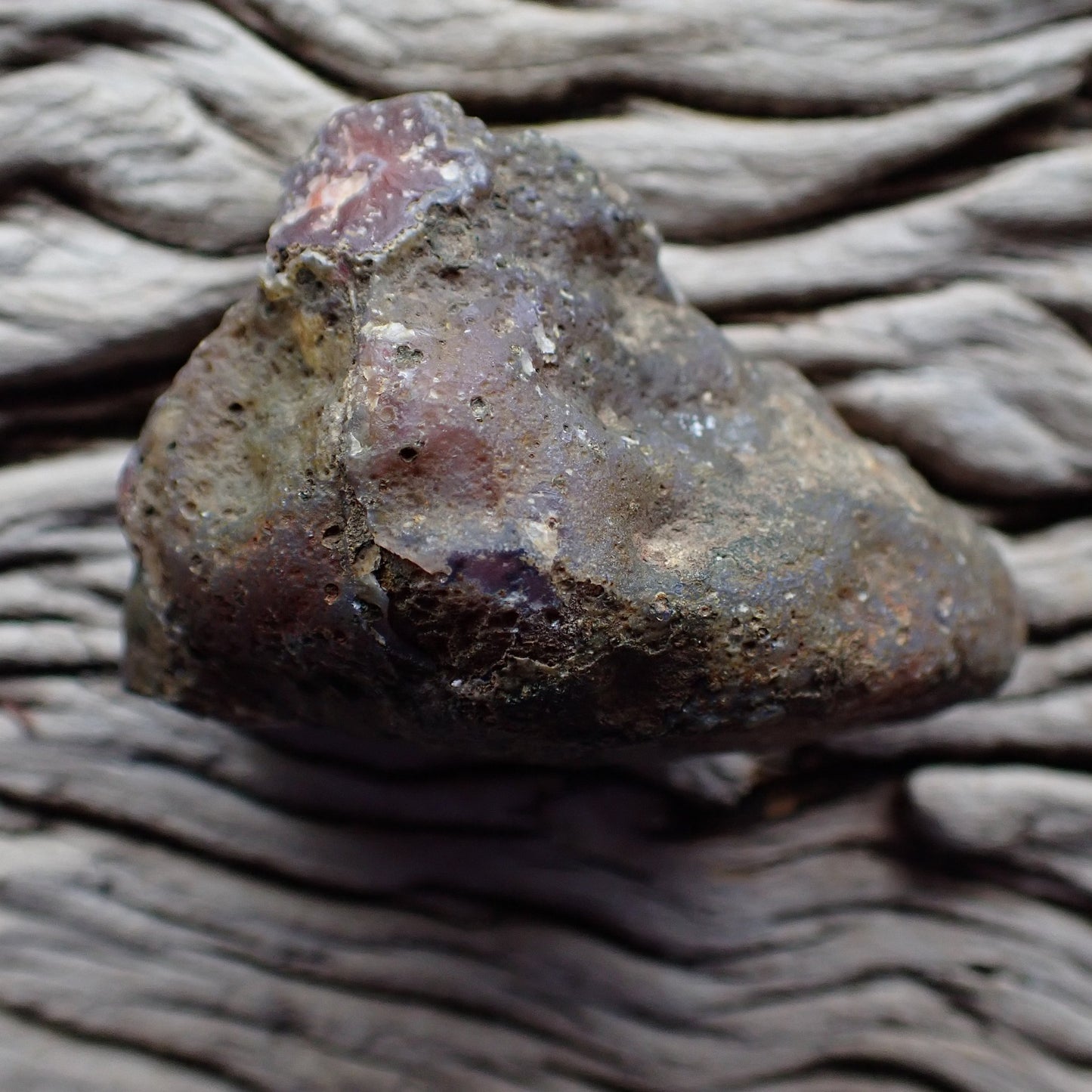 Unpolished rough side of Malawi agate showing natural texture