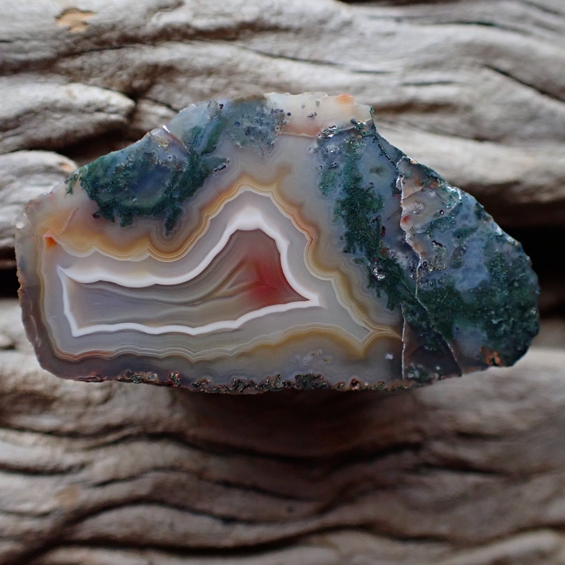 Natural hand-polished Malawi agate 48 mm – full specimen, dramatic two-world face with teal moss inclusions upper half and warm sard-red banding lower half, Ngabu deposit | SKU 000369