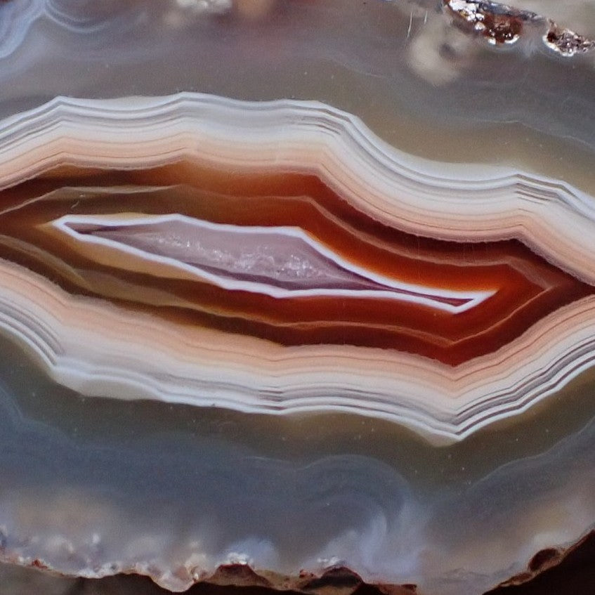 Natural hand-polished Malawi agate 53 mm – face detail, scalloped and ghost banding, cool chalcedony tones, Ngabu sourced | SKU 000377