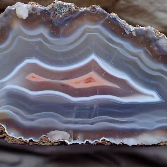 Close-up of layered malawi agate stone with ghost banding