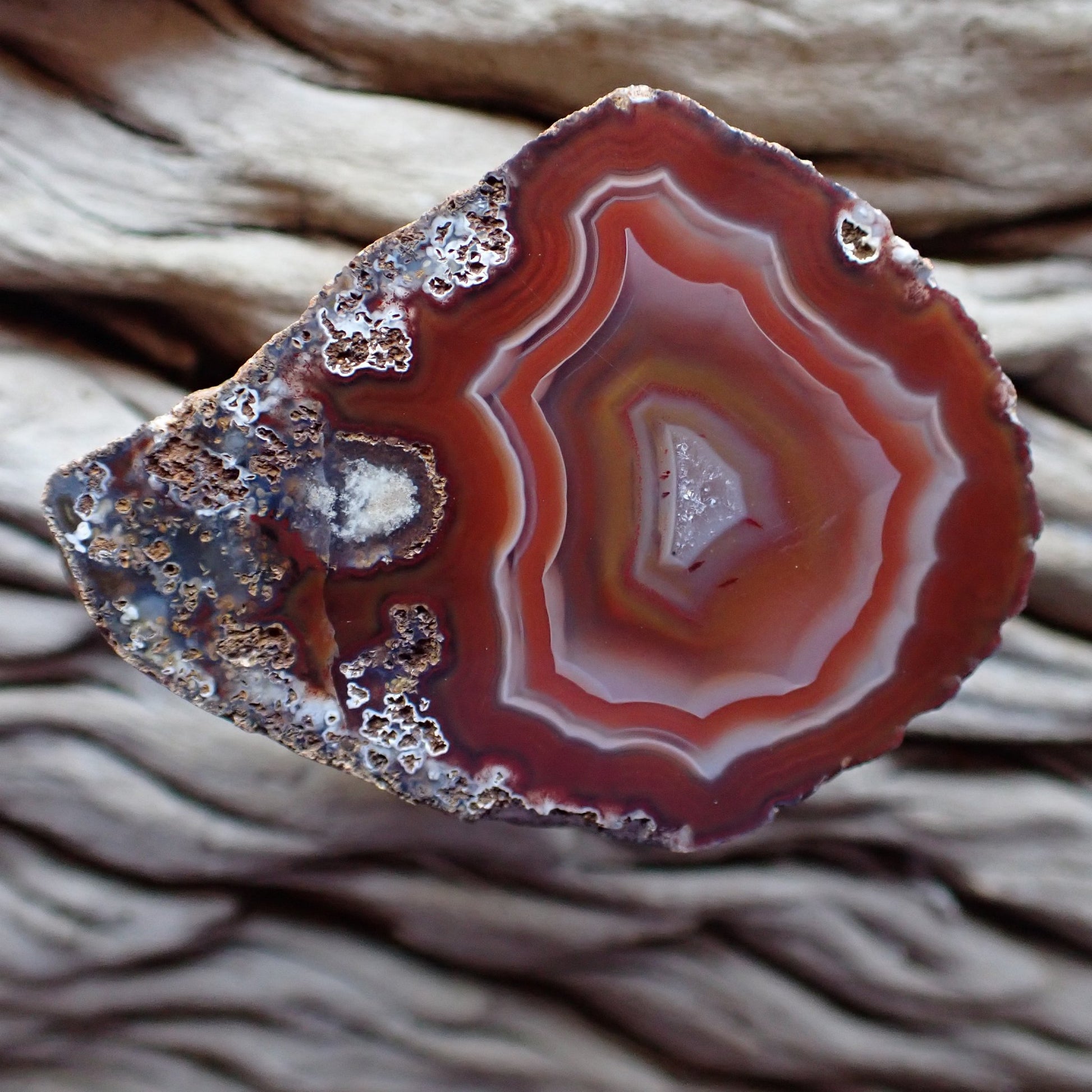 Stunning Malawi Ngabu cut and polished agate with lovely ghost, red and white banding anround a crystaline centre