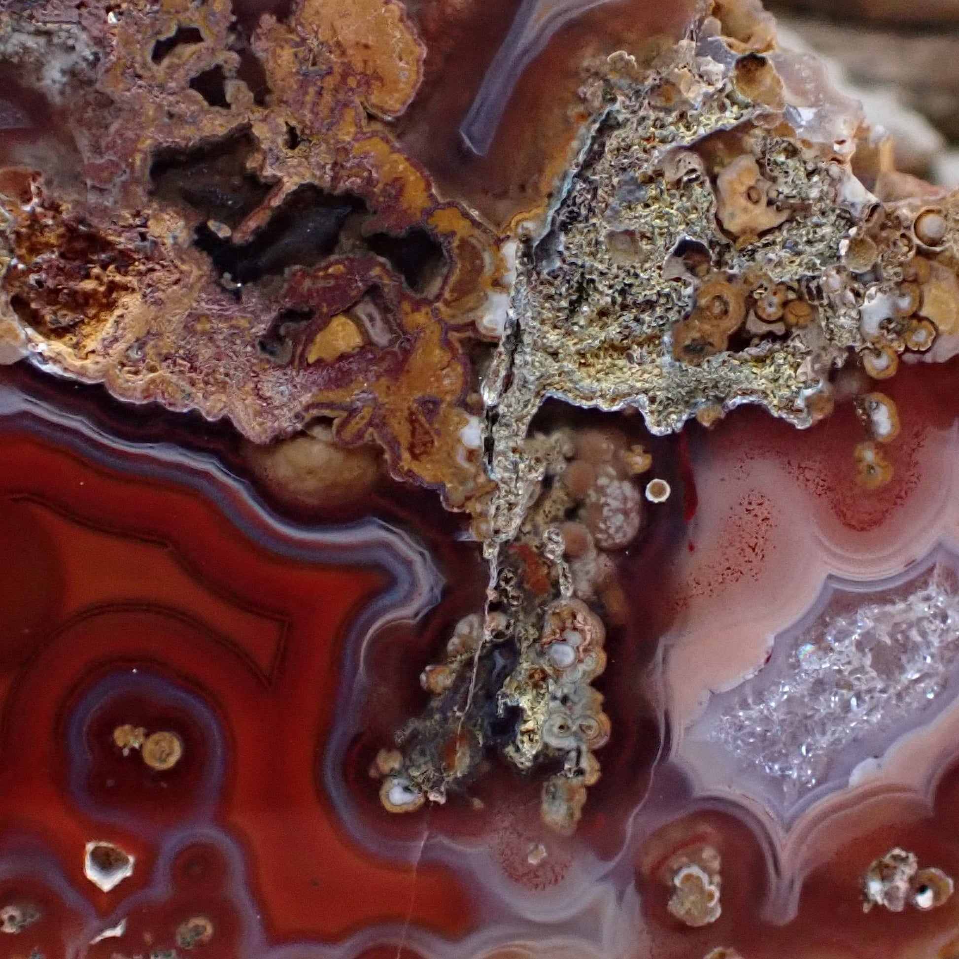 Multi-chamber Malawi agate 58 mm – face detail, agate eye in crimson-red chamber, hematoid spotting, scalloped banding, pink-rose and lavender contrast chamber | SKU 000493