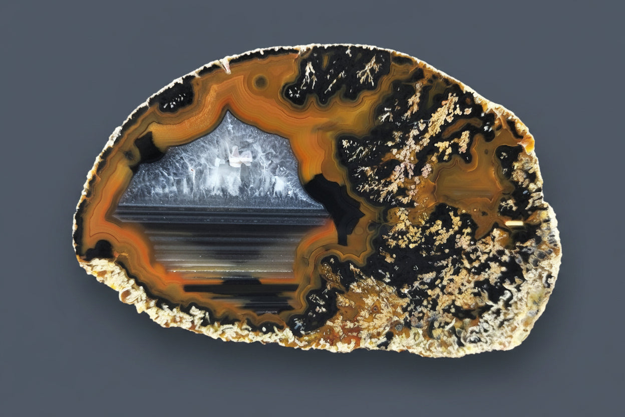 Lilangabi agate 90mm – main view, chalcedony centre, waterlines, dendritic inclusions, orange-black banding | SKU LIL00018