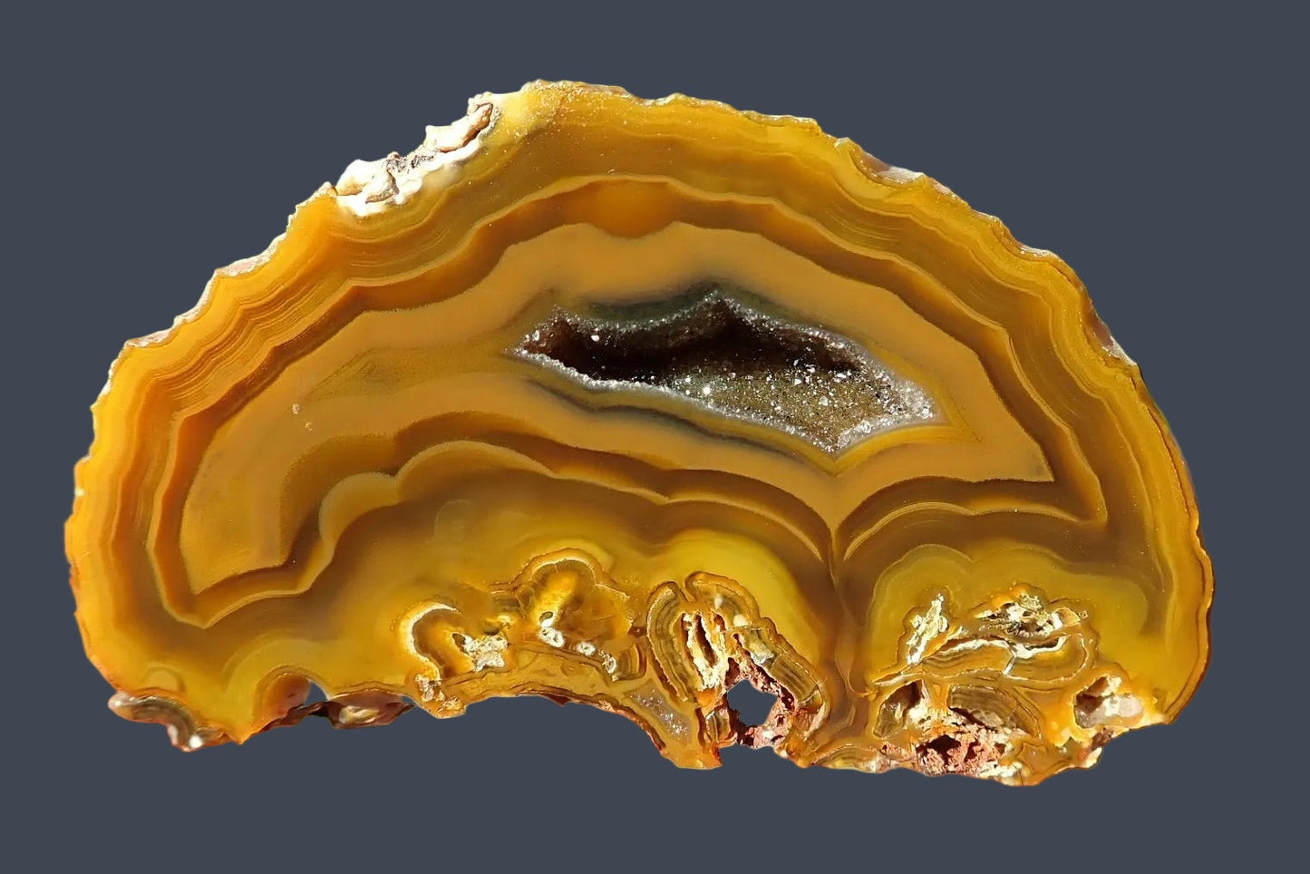 Lilangabi agate 63 mm – front face, angular druzy vug with silver quartz crystals, scalloped banding, amber-golden ground, Eswatini | SKU LIL00031 