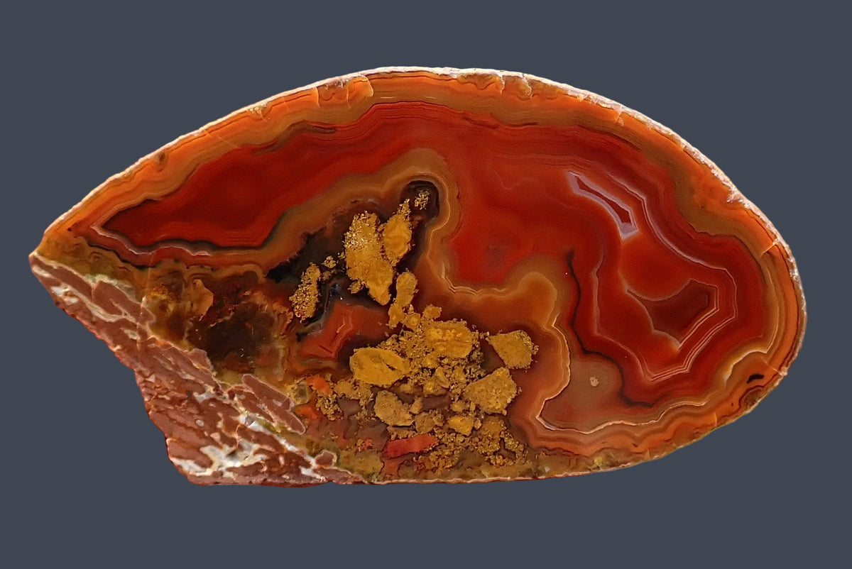 Lilangabi agate with red, burnt orange and amber chromatography and concentric banding, 62 mm
