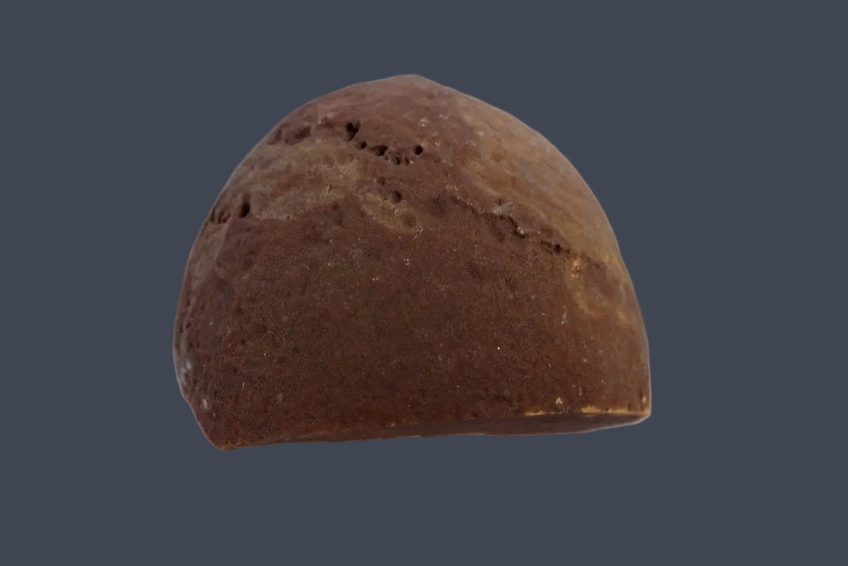 Lilangabi agate 60 mm – back view showing the rounded brown natural rind with small surface pits, Lebombo Mountains.