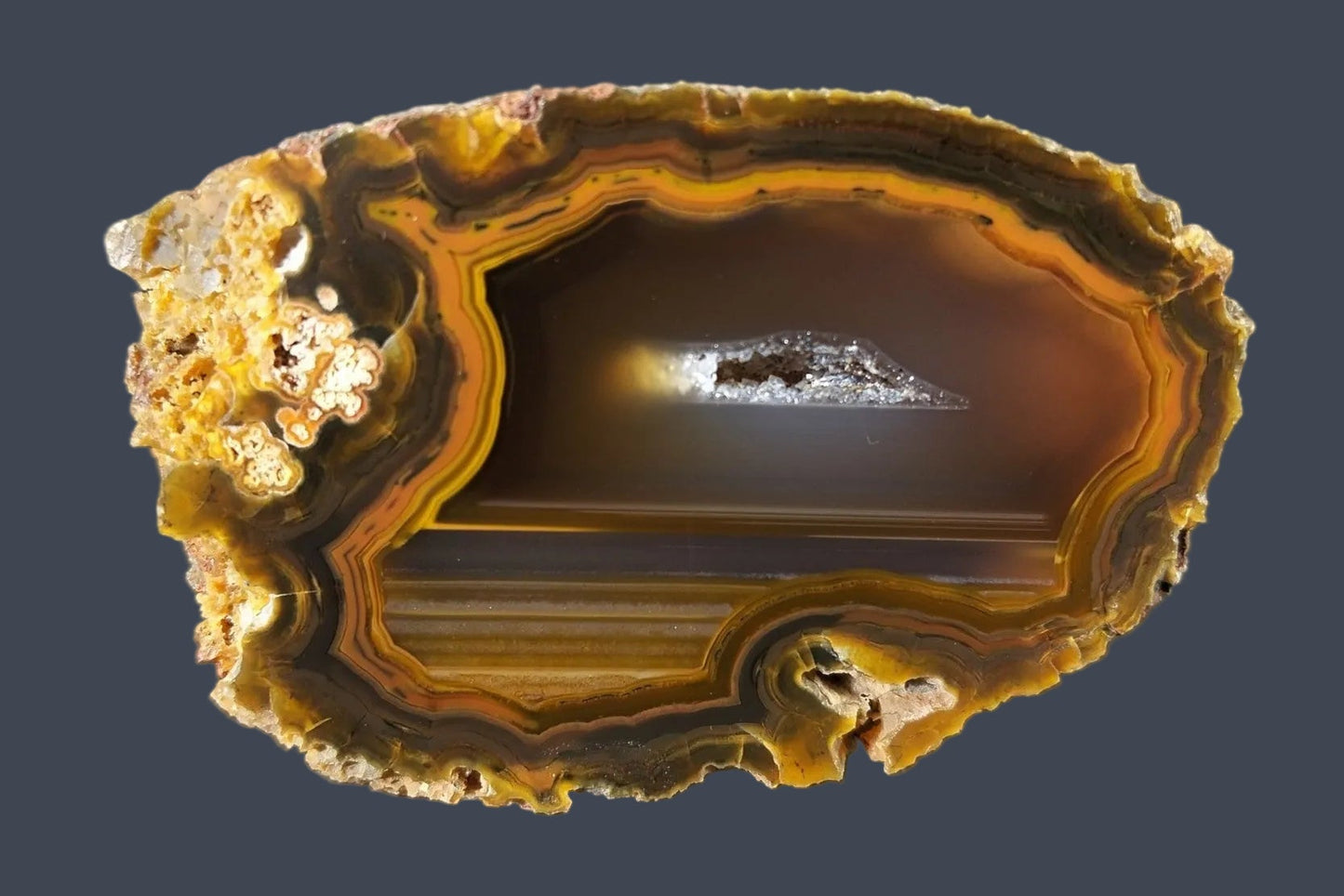 Lilangabi agate 64mm – main view, open vug, scalloped banding, amber-sard palette | SKU LIL00015