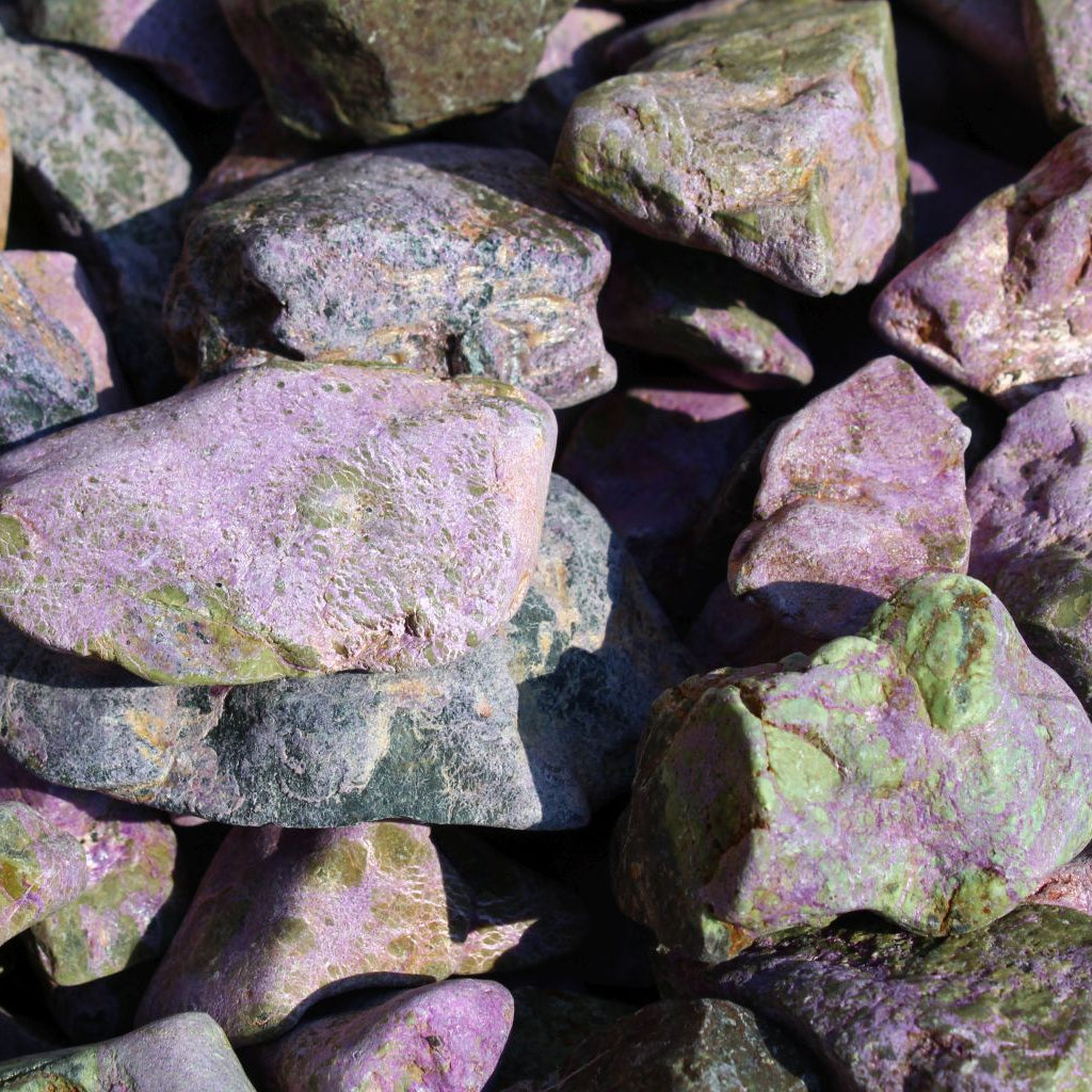 Close up of natural stichtite rough specimens in serpentine matrix, Kaapsehoop, South Africa — bulk lot showing natural unpolished surface and colour variation, dry | SKU STICHRsml