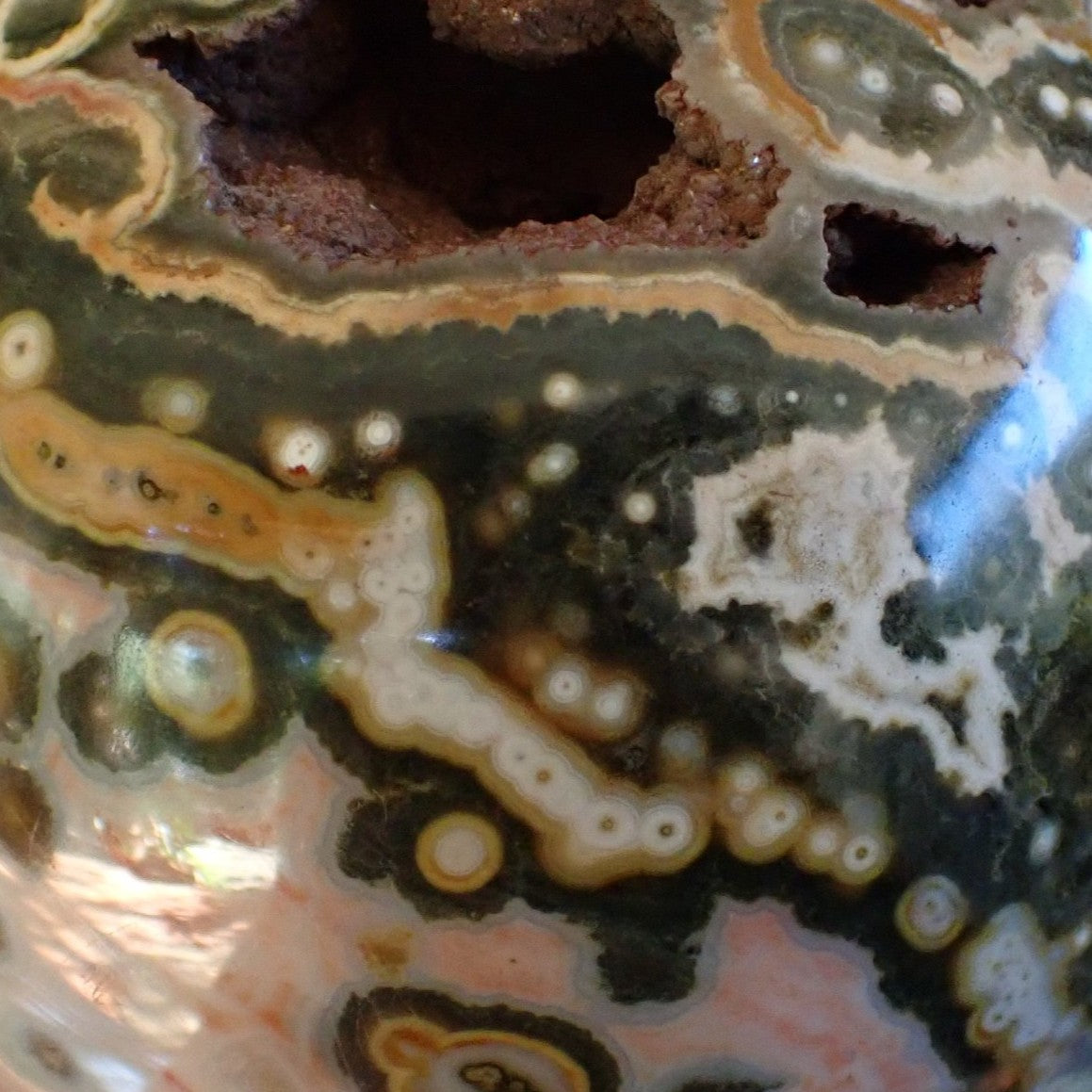  Ocean Jasper (Orbicular) Polished Sphere 115mm – close-up of large amber-ringed orbs and bi-zonal colour contrast, 8th Vein Marovato Madagascar | SKU OM00004