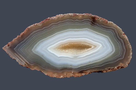 South African agate 87 mm – face view, drusy vug centre, concentric banding, blue-grey chalcedony