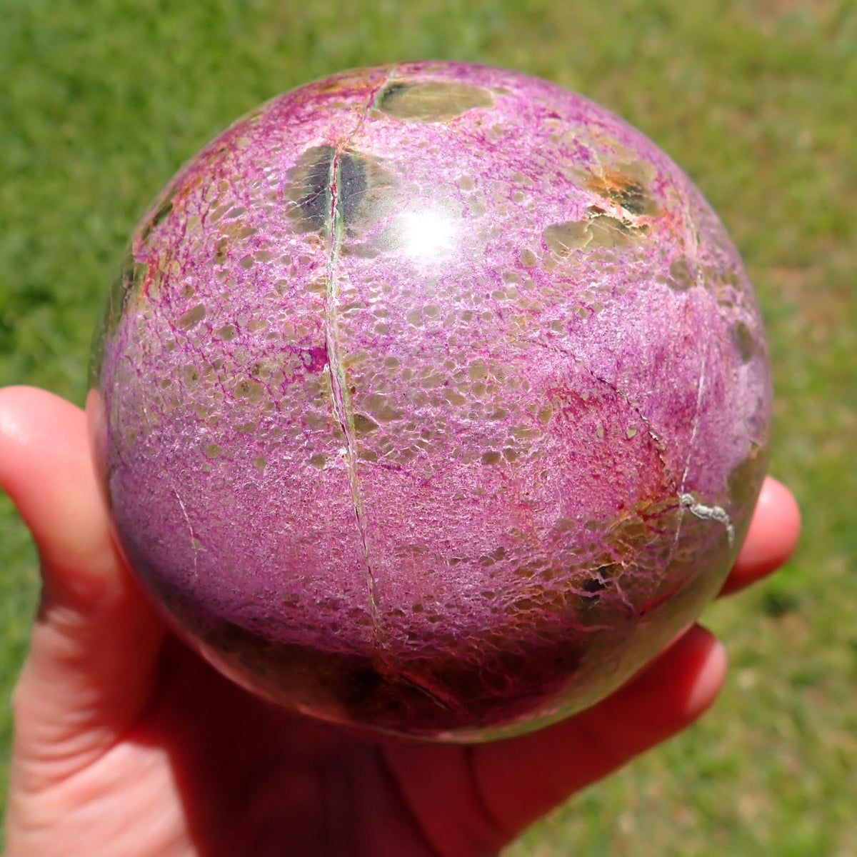 Stichtite with Serpentine sphere showing broad pink-purple intergrowths, small olive patches and pale veining, Mpumalanga, South Africa.