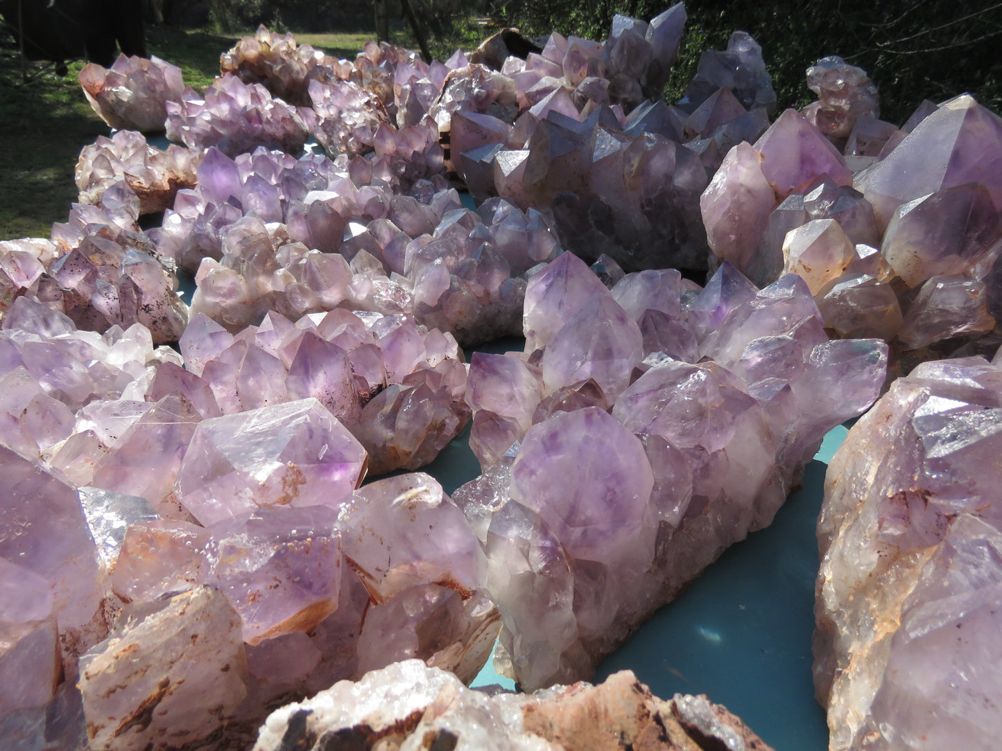 Wholesale Mumbwa amethyst Zambia – bulk lot showing large elongated point clusters, light lavender to violet tones, natural unpolished condition, formation variety visible | SKU MUMkg