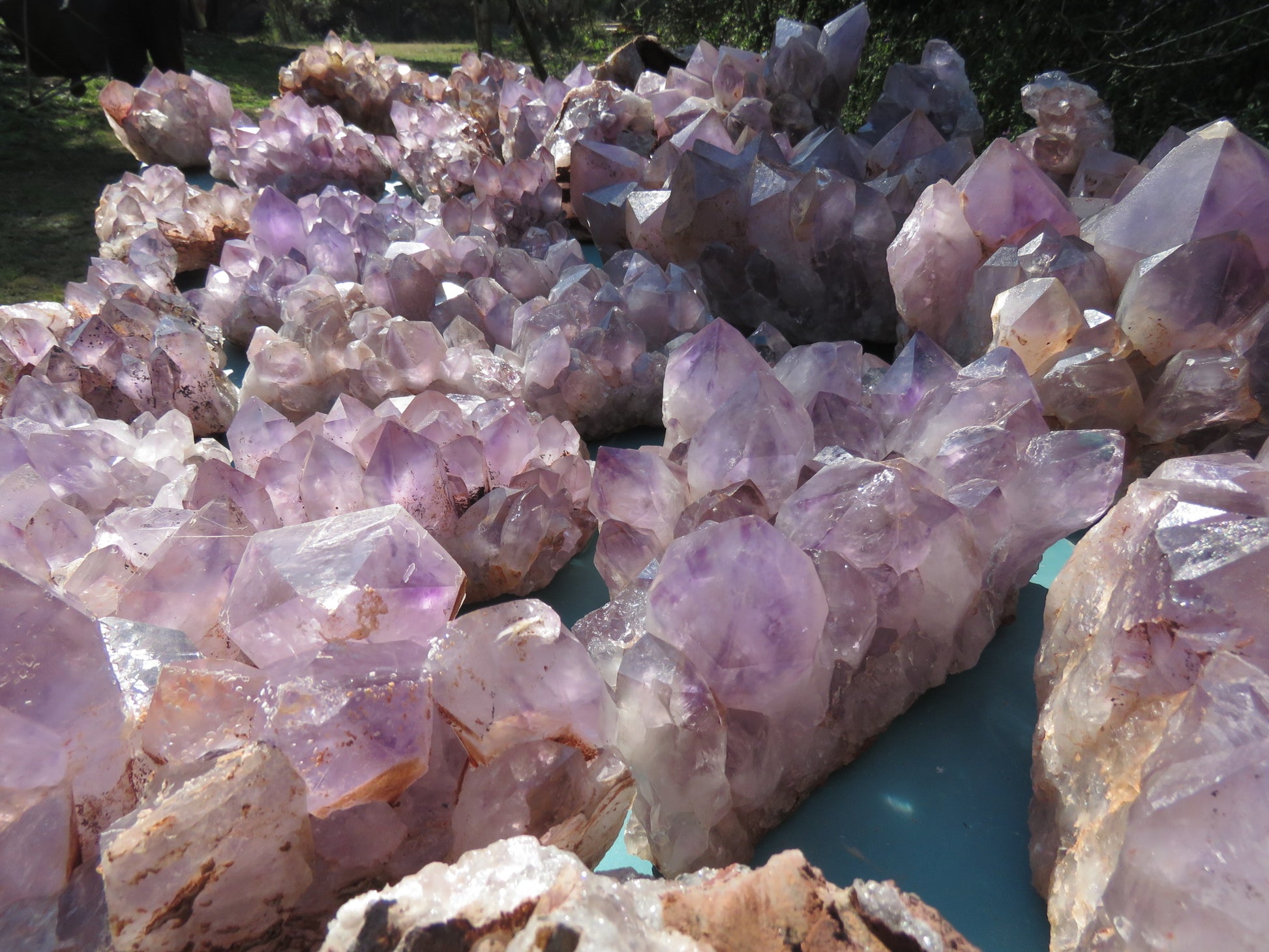 Wholesale Mumbwa amethyst Zambia – bulk lot showing large elongated point clusters, light lavender to violet tones, natural unpolished condition, formation variety visible | SKU MUMkg