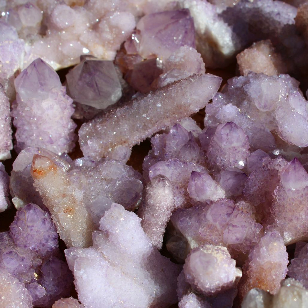 Wholesale spirit quartz South Africa – extreme close-up of cactus quartz finger formations, dense amethyst druzy coverage, light lilac to deep purple tones | SKU SPQA
