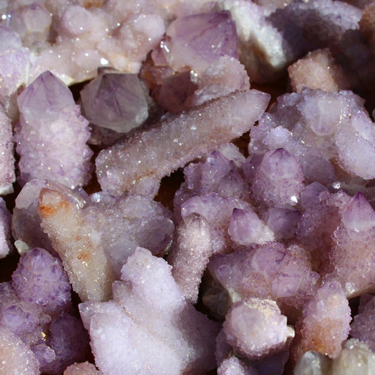 Wholesale spirit quartz South Africa – extreme close-up of cactus quartz finger formations, dense amethyst druzy coverage, light lilac to deep purple tones | SKU SPQA