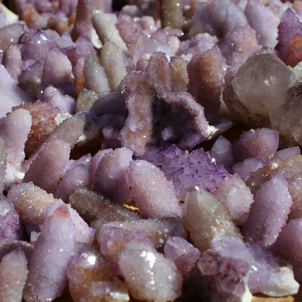 Wholesale spirit quartz South Africa – bulk lot in natural light showing formation variety, elongated finger and compact cluster types, lilac to purple | SKU SPQA