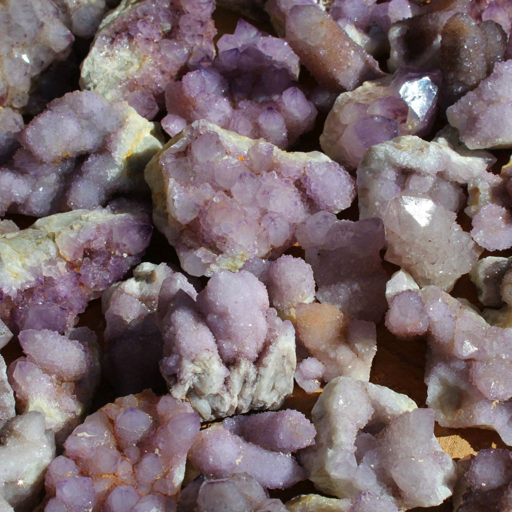Wholesale spirit quartz South Africa – close-up of compact cactus quartz clusters, globular druzy formations, soft lilac to purple, white chalcedony matrix | SKU SPQA