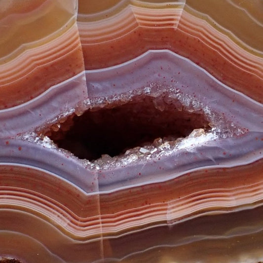 Close-up of a Malawi agate drusy centre ringed in purple