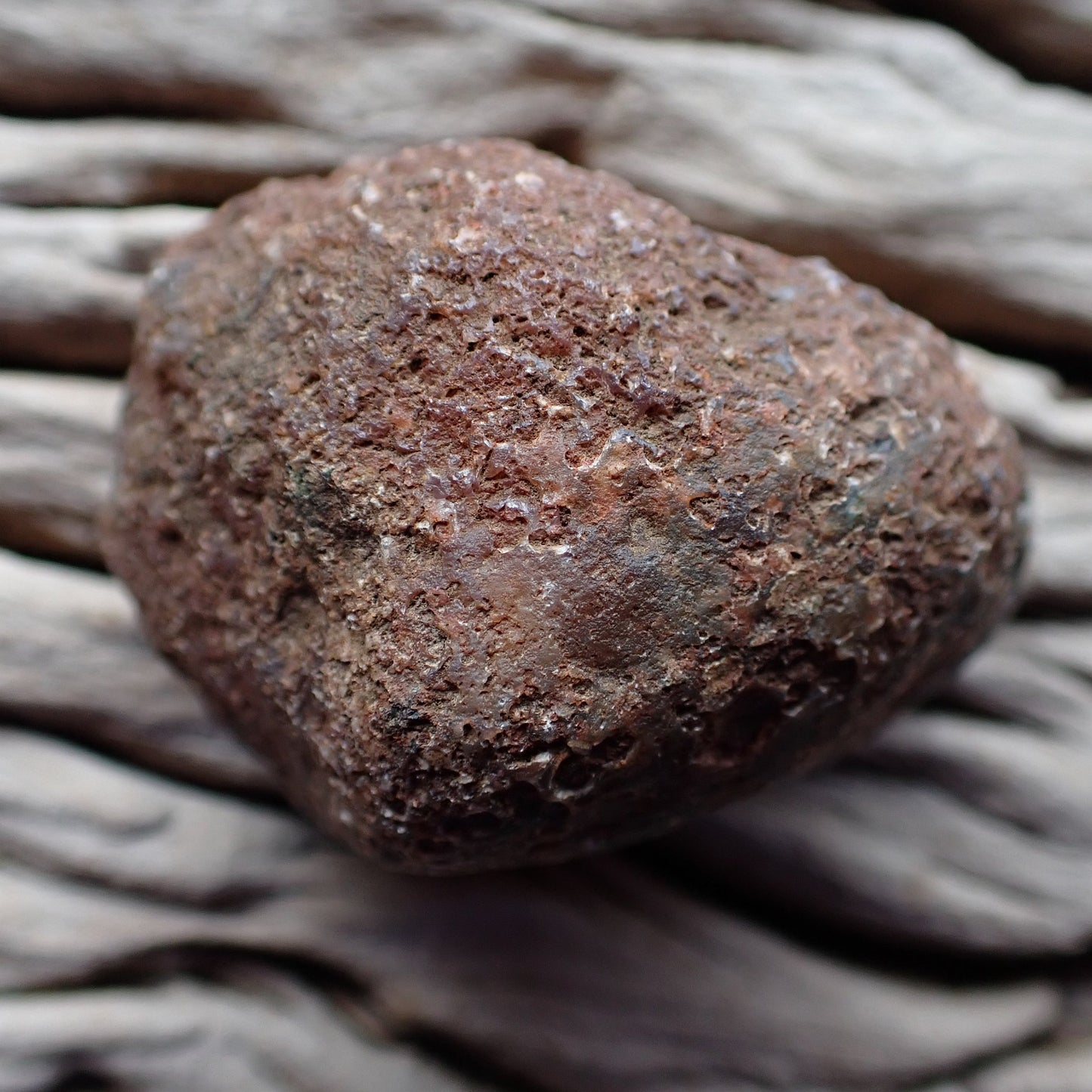 Unpolished rough side of Malawi candy agate showing natural texture