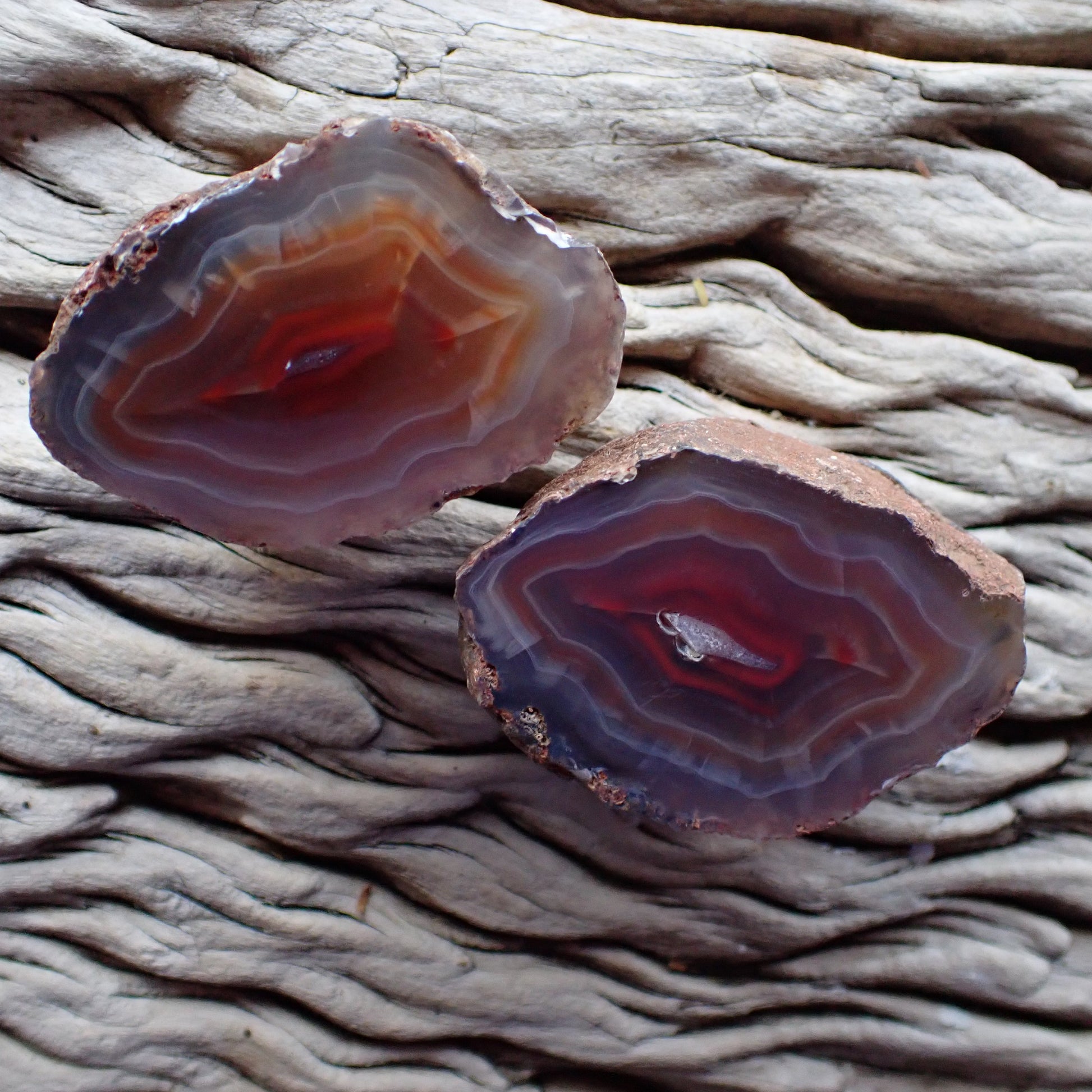 Matching pair of Malawi agates with red orange and purple