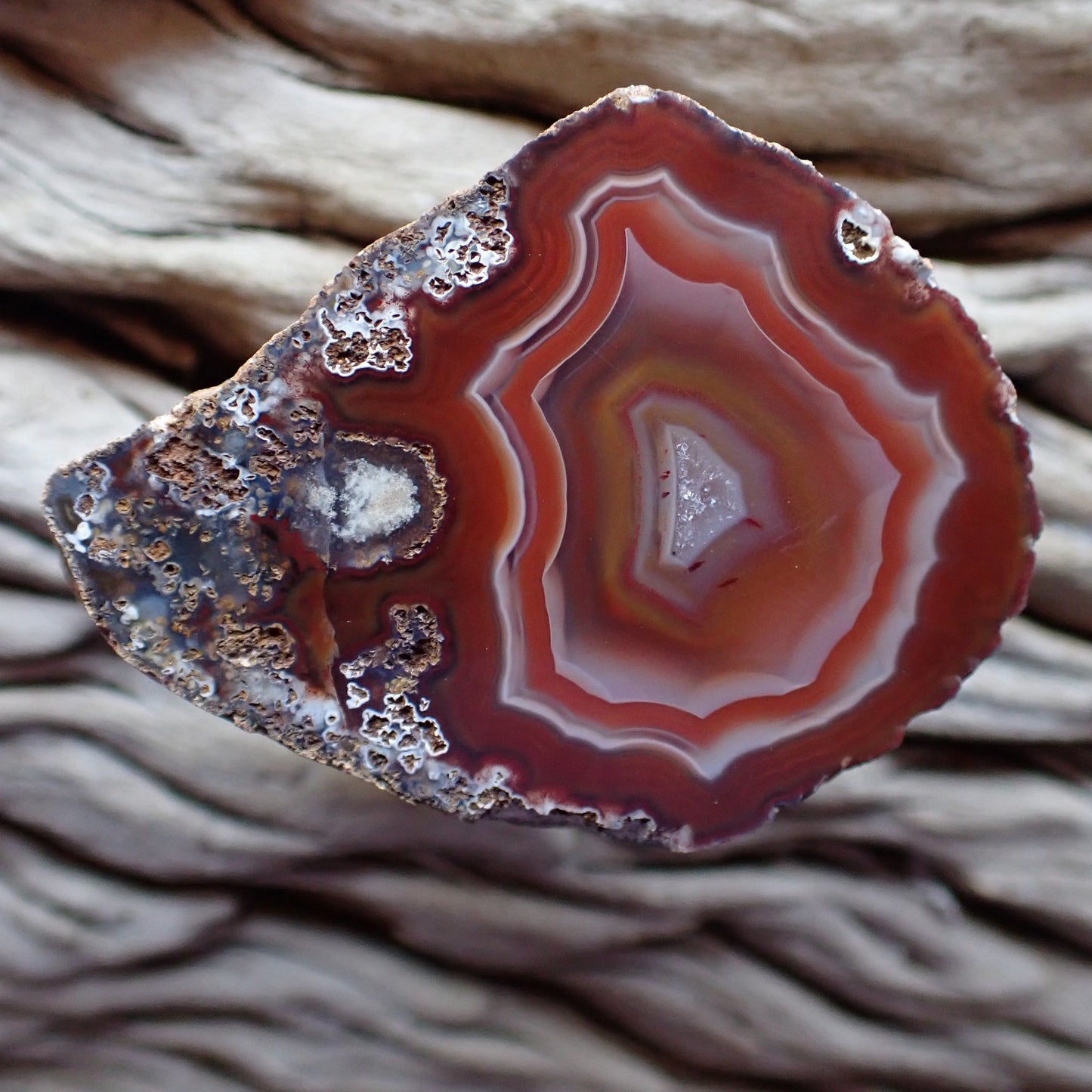 Stunning Malawi Ngabu cut and polished agate with lovely ghost, red and white banding anround a crystaline centre
