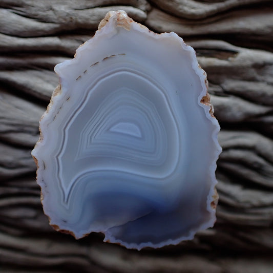 Cut and polished Malawi Ngabu agate with white grey and slightly blue layers