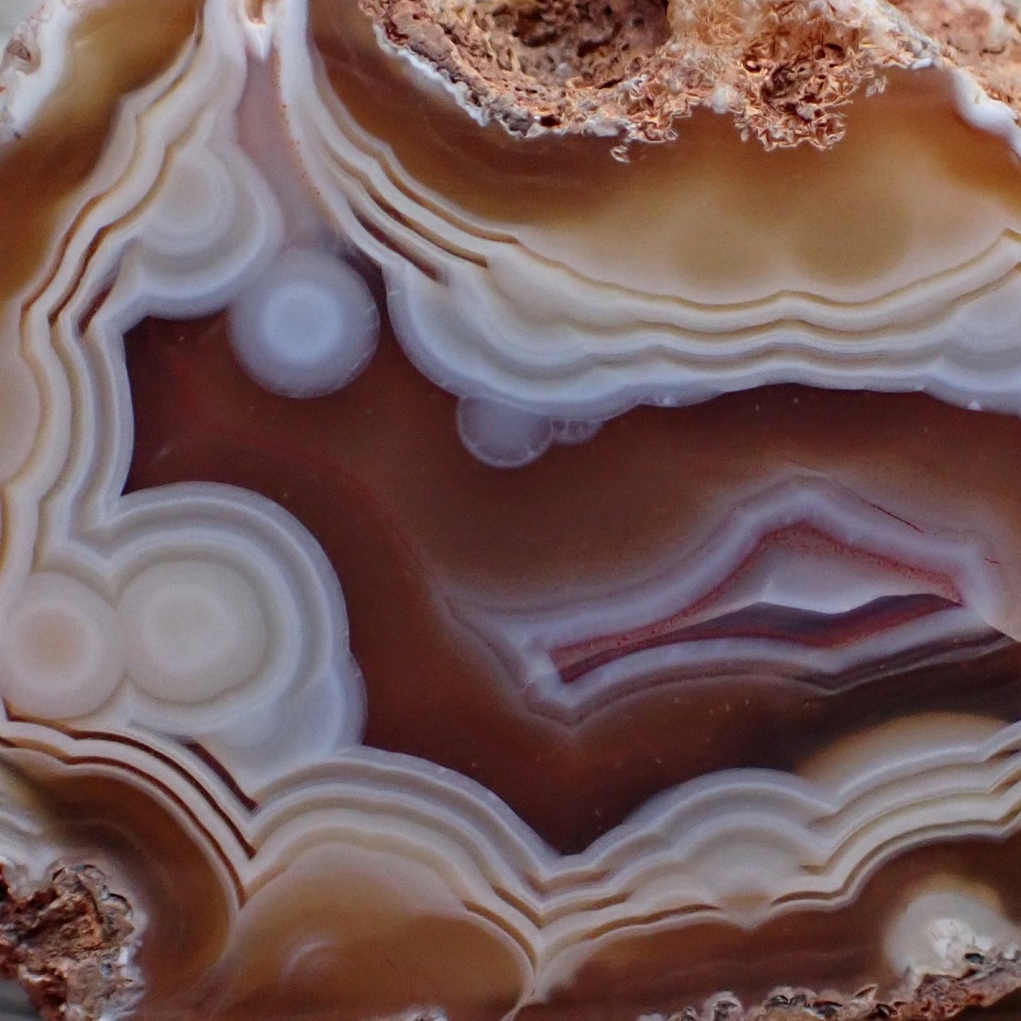 Natural hand-polished Malawi agate 52 mm – face detail, agate eyes, flow channel, fortification banding, ghost banding | SKU 000499