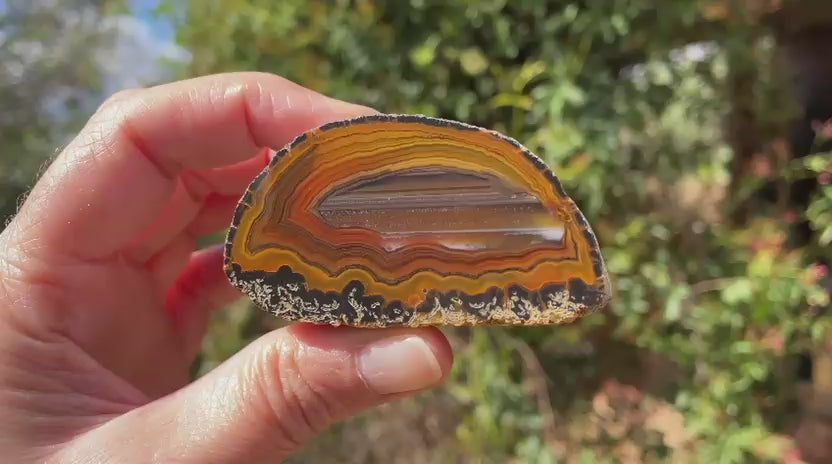 Lilangabi agate 66 mm – rotating view, waterlines, chromatism, fortification banding, scalloped banding