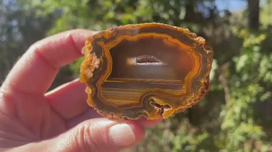 Lilangabi agate 64mm – video, vug and waterlines, amber-sard colour depth | SKU LIL00015