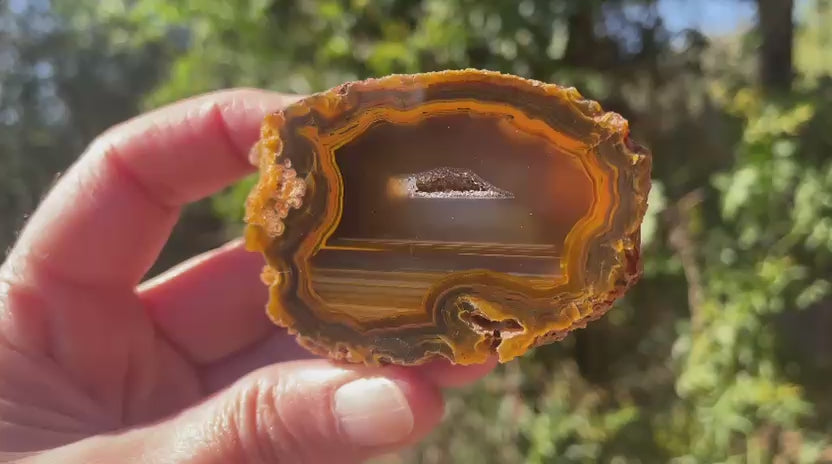 Lilangabi agate 64mm – video, vug and waterlines, amber-sard colour depth | SKU LIL00015
